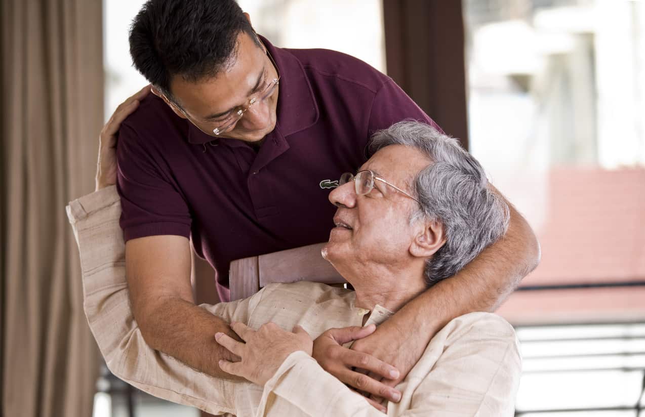 Man spending time with his father at home